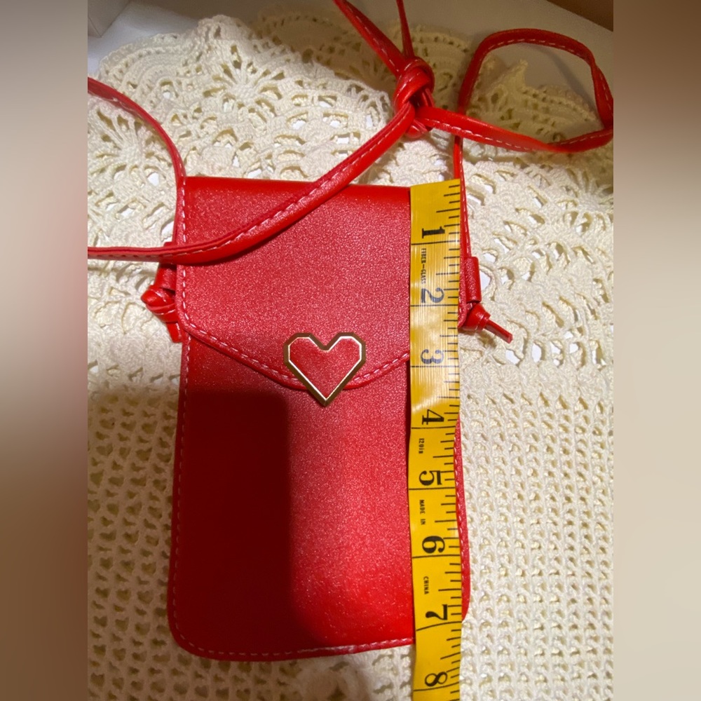 3/$15 Red faux leather crossbody with heart snap and clear back - Picture 4 of 10
